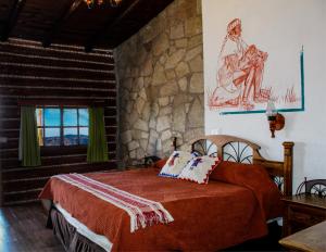 Rúm í herbergi á Hotel Divisadero Barrancas