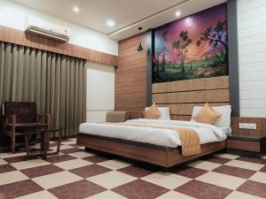 Hotel Anil Farmhouse Gir Jungle Resort客房内的一张或多张床位