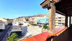 a view of a city with buildings and a street at Puerto Santiago Plaza in Puerto de Santiago
