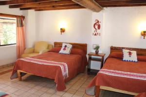 Rúm í herbergi á Hotel Divisadero Barrancas