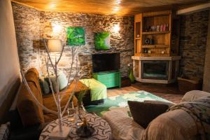 a living room with a couch and a fireplace at Casa da Ferreira_Vila Real in Vila Real