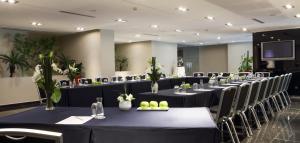 a row of tables and chairs in a room at Mövenpick Hotel Casablanca in Casablanca +166 photos