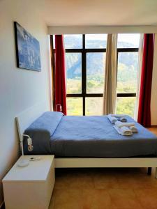 A bed or beds in a room at Sofia Apartment