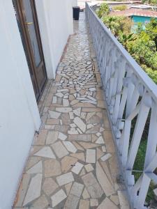 a stone walkway next to a balcony at Hotel Canarias Paso Canoas in Canoas