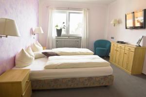 Кровать или кровати в номере Hotel Berg