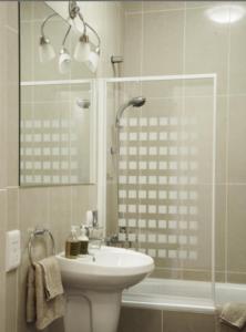 a bathroom with a toilet and a sink and a shower at Villa Dorota in Zakopane