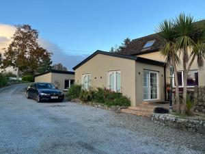 a car parked in front of a house at The Cupán in Mountshannon +26 photos