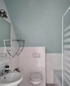 a bathroom with a sink and a toilet and a mirror at Villa Dorota in Zakopane +42 photos