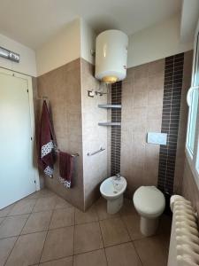 a bathroom with a toilet and a sink at La Stella Blu in Gatteo a Mare