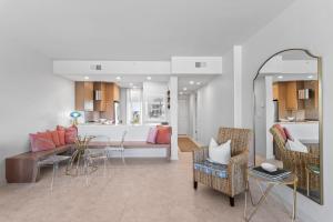 a living room with a couch and a table and chairs at High Pointe Resort 414 in Rosemary Beach +40 photos