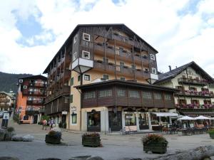 a large building in the middle of a town at Sport Campiglio Apartment in Madonna di Campiglio