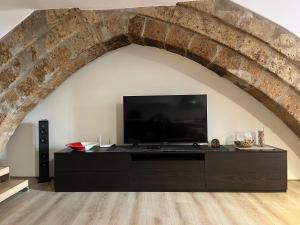 Televízia a/alebo spoločenská miestnosť v ubytovaní Home in Orvieto - Corso Cavour