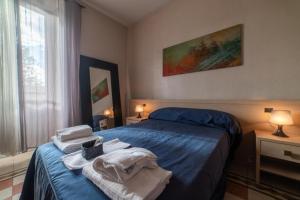 Postel nebo postele na pokoji v ubytování Reyes Suite & Rooms