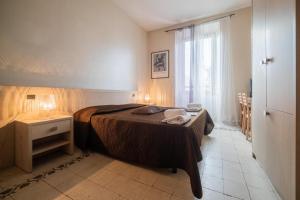 Postel nebo postele na pokoji v ubytování Reyes Suite & Rooms