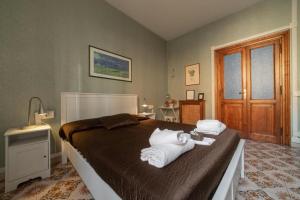 Postel nebo postele na pokoji v ubytování Reyes Suite & Rooms