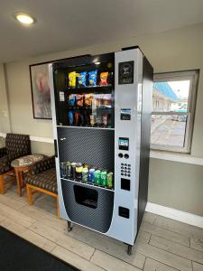 a large refrigerator with drinks in a room at Rodeway Inn Moosic - Scranton in Moosic