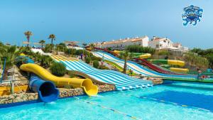 a water park with a bunch of slides in the water at Hotel Velis in Vélez-Málaga