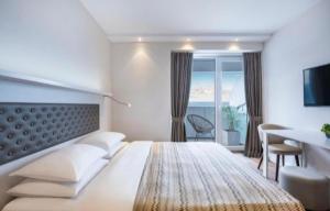 Postel nebo postele na pokoji v ubytování Batumi Hotel Room