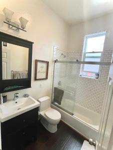 a bathroom with a toilet and a shower and a sink at Luxury Nob Hill Penthouse - Entire Condo in San Francisco