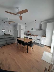 a living room with a table and a couch at La casita de la Alquería, Montanejos in Montanejos