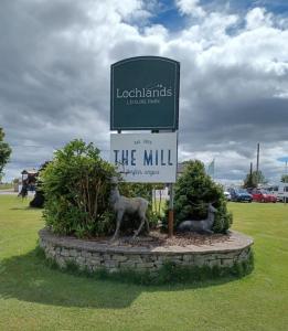 a sign for the mill with two animals on it at 49 Tay - The Cottage Caravan in Angus