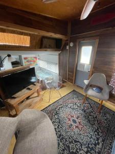 a living room with a couch and a rug at Updated houseboat on the river! in Fort Lauderdale