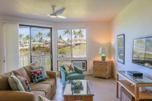 a living room with a couch and a table at Wailea Grand Champions Villas - CoralTree Residence Collection in Wailea