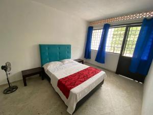 Postel nebo postele na pokoji v ubytování Hostel Flandes tu sitio