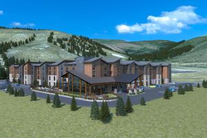 a rendering of a building with a mountain in the background at SpringHill Suites by Marriott Avon Vail Valley in Avon