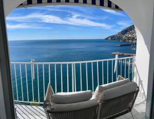 a balcony with a view of the ocean at Amalfi Saracena House in Amalfi