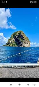 a view of an island in the ocean from a boat at Douceur des Hauteurs bas de villa, piscine privée in Sainte-Luce