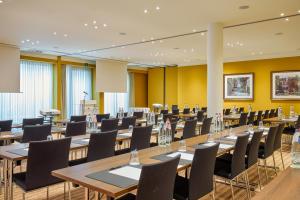 a large conference room with tables and chairs at Grand Hotel Casselbergh in Bruges