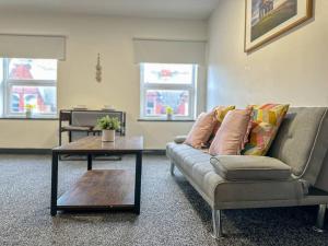 a living room with a couch and a coffee table at Cosy 1BR Retreat in Sunderland - Flat 3 in Sunderland