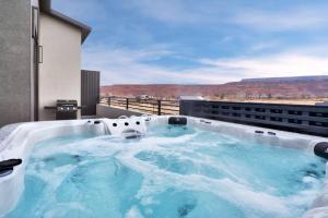 a hot tub on the roof of a building at Vizcaya #6 - Moab's Newest Luxury Rental in Moab