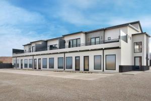 a large white building with a lot of windows at Vizcaya #6 - Moab's Newest Luxury Rental in Moab +6 photos