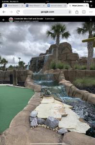 a rendering of a golf course with a water fountain at Love Shack in Foley/ Hot Tub / Modern Cozy in Foley