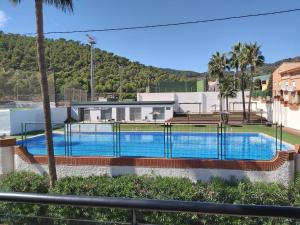 a swimming pool in front of a house at Playa y Montaña Faura-Valencia in Faura