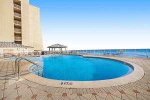 a large swimming pool in front of a building at Beach House in Destin