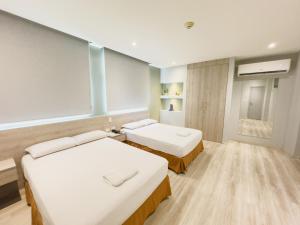 Voodi või voodid majutusasutuse GH Sander Hotel toas