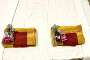 two bags sitting on top of a white table at Accra Luxury Apartments At The Sanga Estates in Accra