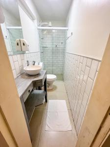 a bathroom with a sink and a toilet at Sonho de Iracema Hostel Boutique in Fortaleza