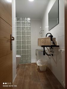 a bathroom with a sink and a toilet at Casa Bea in Cangas de Onís
