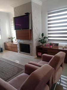 TV a/nebo společenská místnost v ubytování Pousada La Casona