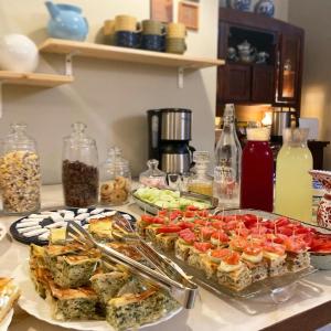 a table with a bunch of food on it at Vila Dunavski Raj in Golubac
