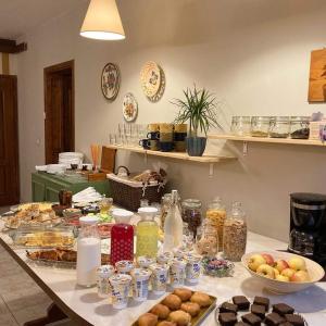a table with many different types of food on it at Vila Dunavski Raj in Golubac