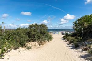 a path through the sand at the beach at Grunwaldzka 12 A4 Easy-Rent Apartments - 50m od plaży z dużym tarasem in Pobierowo
