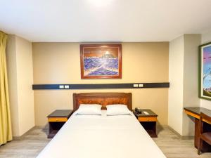 Postelja oz. postelje v sobi nastanitve GH Alexander Hotel