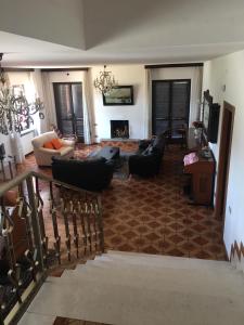 a living room with couches and a fireplace at Villa Matilde in Pescara +23 photos