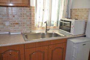 Kuchyň nebo kuchyňský kout v ubytování Neptune Resort