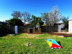 a kite sitting on the grass in a yard at The Winemakers Quarters in Tanunda